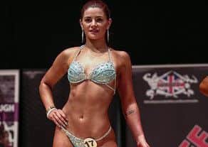 Erin competing in a bodybuilding contest