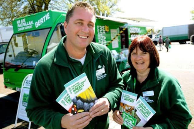 Phil Warner and Elaine Perry with Bertie, the Macmillan Mobile Information Bus