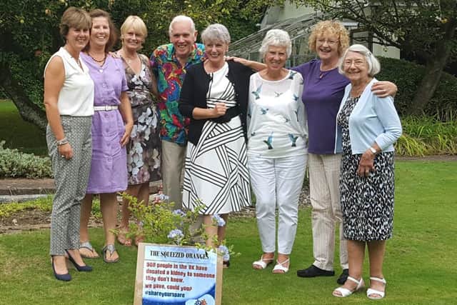 The members of The Squeezed Oranges altruistic donation club - from left, Lesley Clayton, Sue Day, Cherry Williams, Nicholas Crace,  Judi McGetrick, Susanne Dadswell, Trish Bailey and Jane Shorrock
