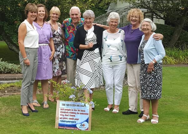 The members of The Squeezed Oranges altruistic donation club - from left, Lesley Clayton, Sue Day, Cherry Williams, Nicholas Crace,  Judi McGetrick, Susanne Dadswell, Trish Bailey and Jane Shorrock