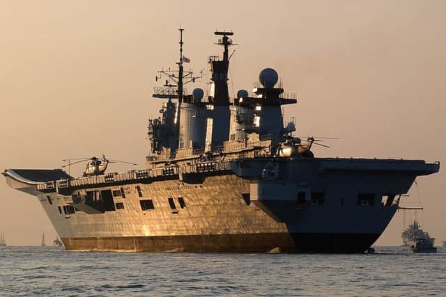 EMOTIONAL: The sun set as Illustrious is set to make her final voyage from Portsmouth on Wednesday   PHOTO: POA(Phot) Russell-Stevenson