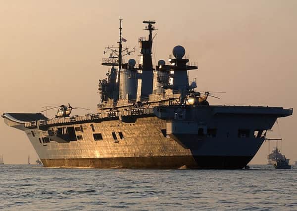 EMOTIONAL: The sun set as Illustrious is set to make her final voyage from Portsmouth on Wednesday   PHOTO: POA(Phot) Russell-Stevenson