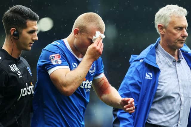 Pompey striker Curtis Main cut his head during a clash with Wycombe Wanderers earlier this month Picture: Joe Pepler