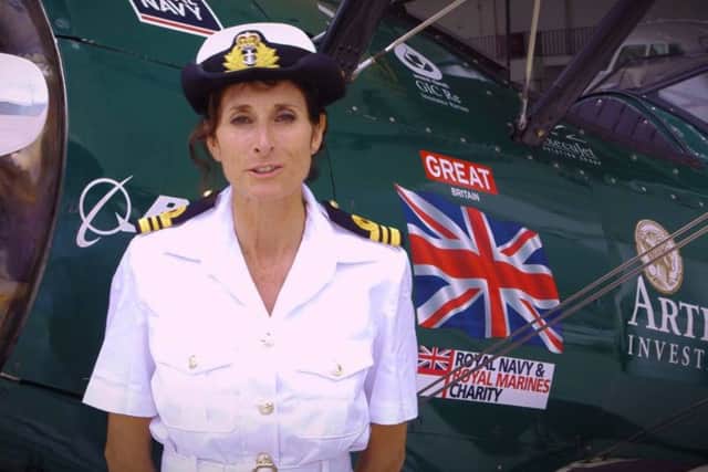 Tracey Curtis-Taylor flew from Africa to Goodwood in a biplane - but there is a row as to whether it was a solo flight or not