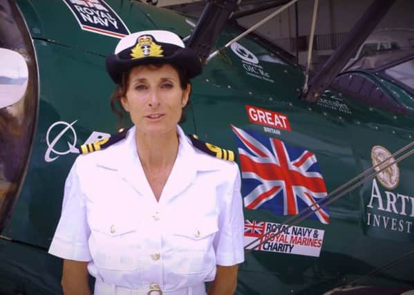 Tracey Curtis-Taylor flew from Africa to Goodwood in a biplane - but there is a row as to whether it was a solo flight or not