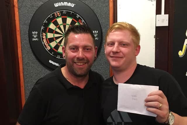 Rich North, right, claimed the Â£400 winners prize in Portsmouth Darts Series Justice competition