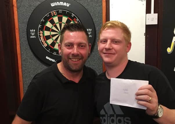 Rich North, right, claimed the Â£400 winners prize in Portsmouth Darts Series Justice competition