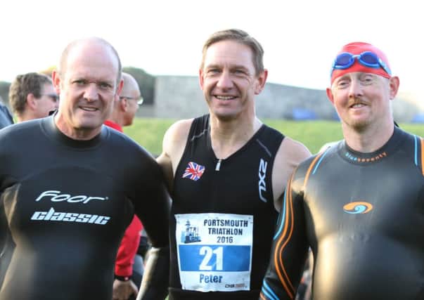 From left: Richard Wheeler, Olympic distance race winner Peter Younghusband and Tim Hardy. Picture: Habibur Rahman (161312-35)