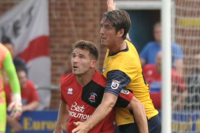 Gosport Borough defender Brett Poate, right Picture: Mick Young