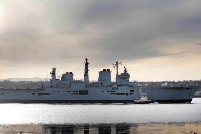 HMS Illustrious passes under the Forth Rail Bridge in 2010