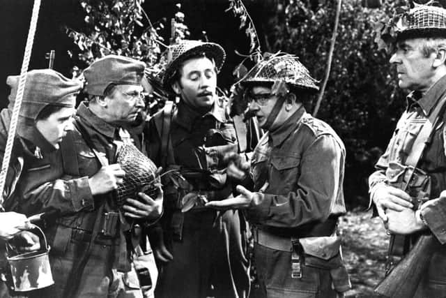 James Beck (centre) as spiv Private Walker