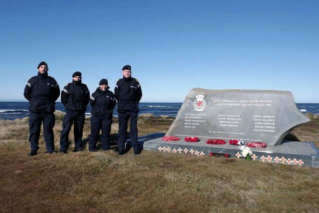 Sailors from HMS Clyde at the memorial to destroyer HMS Glamorgan on the Falkland Islands