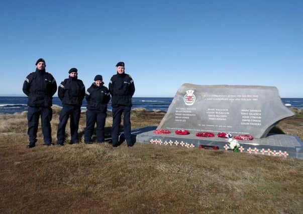 Sailors from HMS Clyde at the memorial to destroyer HMS Glamorgan on the Falkland Islands
