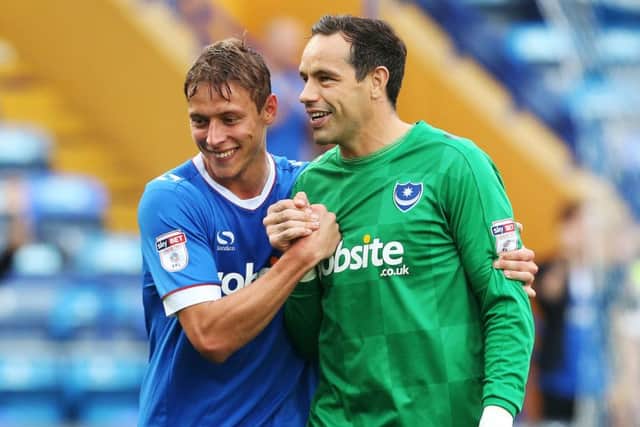 Tom Davies, left, with Pompey keeper David Forde after the 5-1 win against Barnet on Saturday Picture: Joe Pepler
