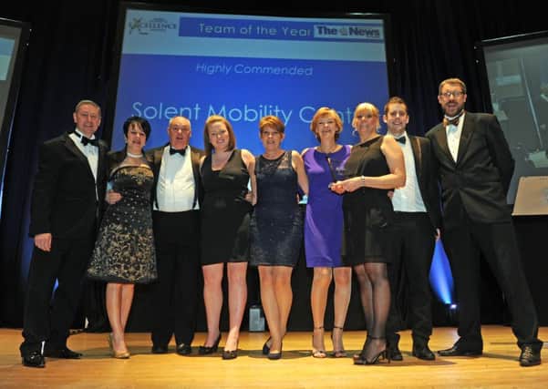 Solent Mobility Centre on stage after being highly commended in the Team of the Year category at The News Business Excellence Awards 2015