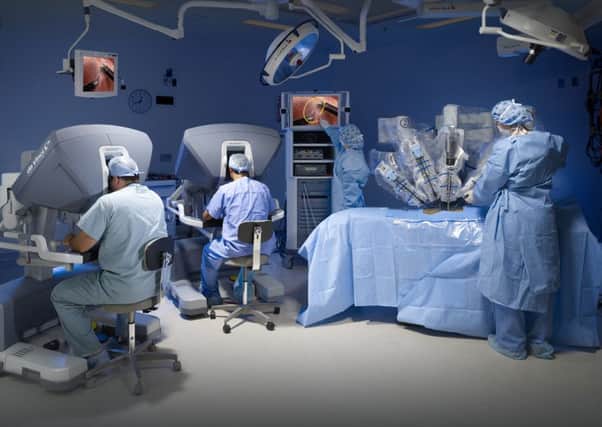 The Da Vinci robot in use Picture: Mark Clifford/Intuitive Surgical