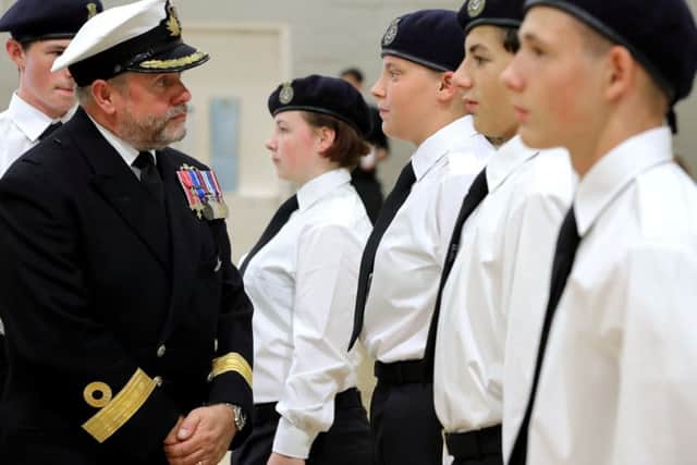 Commodore Bob Fancy inspects Charter Academy pupils who are part of the school's Combined Cadet Force