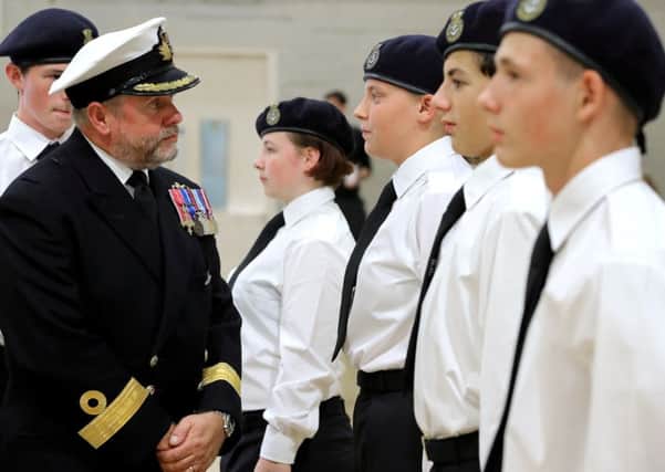 Commodore Bob Fancy inspects Charter Academy pupils who are part of the school's Combined Cadet Force