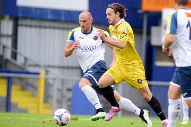 Hawks defender Lee Molyneaux, left Picture: Allan Hutchings