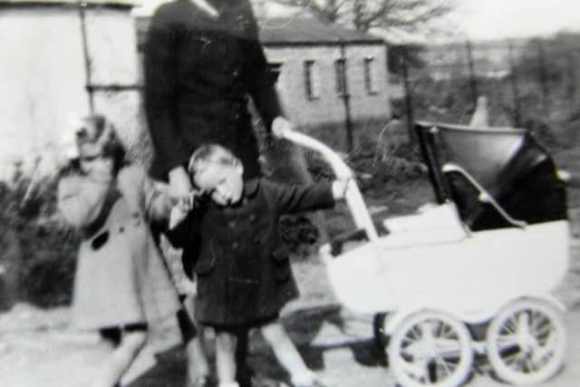 Inge Philpot with three of her children standing  in what I believe to be Hooks Farm Way, Bedhampton today.