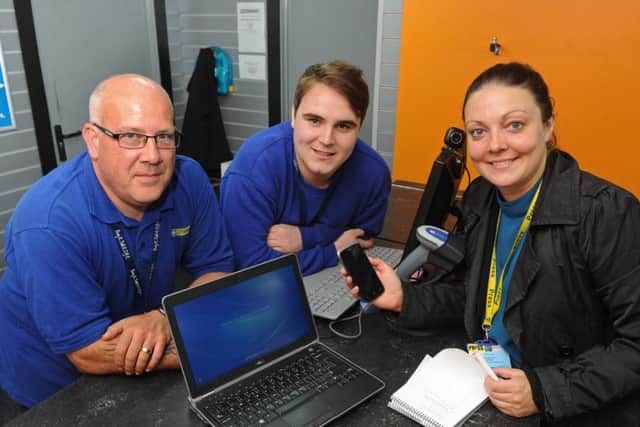 News reporter Kimberley Barber with the recovered laptop, phone and personal effects, with Cash Generator staff Lee Saunders, left, and Matt Scott
Picture: Ian Hargreaves (161090-5)