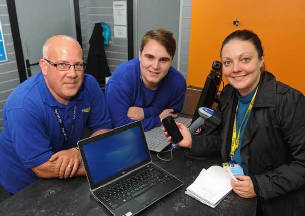 News reporter Kimberley Barber with the recovered laptop, phone and personal effects, with Cash Generator staff Lee Saunders, left, and Matt Scott 
Picture: Ian Hargreaves (161090-5)