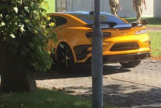 The yellow Chevrolet Camaro parked at Fort Blockhouse