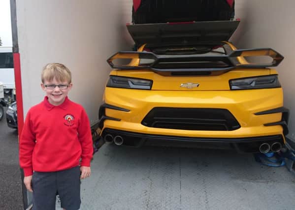 Layton Bradley, six, got a sneak preview of the set of Transformers 5 after his dad Gez, 31, took him to the film set at the Royal Navy Submarine Museum in Gosport early on Thursday morning.

 Layton is pictured with the Bumblebee car used in the film, voiced by actor Mark Ryan