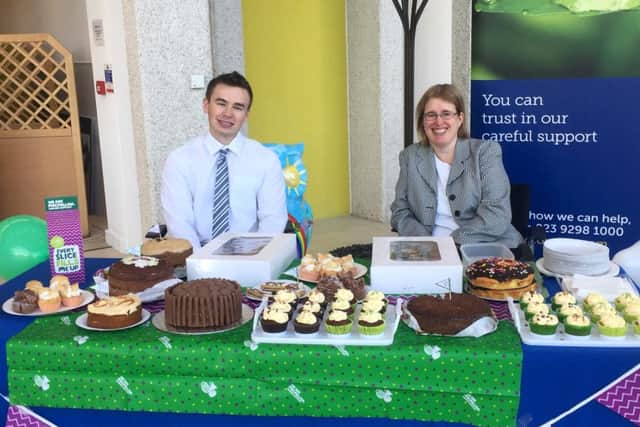 Ryan Pledge and Selina Williamsfrom Verisona Law doing their bit for Macmillan's cake sale in 1000 Lakeside
Picture: Izzy Ash.