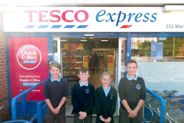 Locks Heath Junior School pupils, Cora Banyard, Jacob Lynes, Lucy Selby and Callum Elcombe outside Tesco