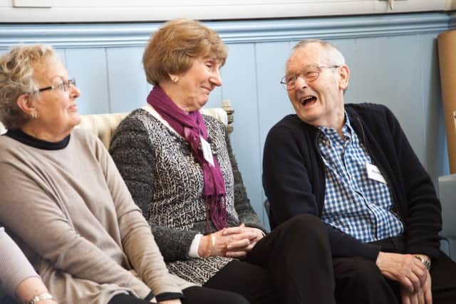 Members of Brendoncare sharing a giggle