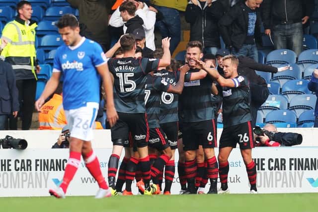 Doncaster players celebrate after taking the lead at Fratton Park. Picture: Joe Pepler