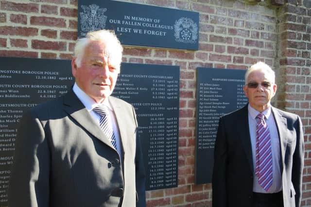 Brothers Martin and Stan Spooner next to the memorial, which includes their father PC Stanley's name. He died in an air raid in Portsmouth on July 11, 1940 aged 28