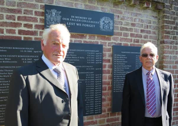 Brothers Martin and Stan Spooner next to the memorial, which includes their father PC Stanley's name. He died in an air raid in Portsmouth on July 11, 1940 aged 28