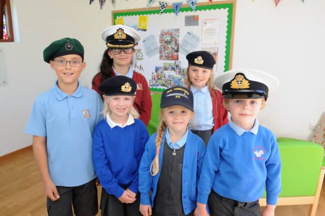 Back from left, Bethan Dew, 11 and Caitlyn Pickles, eight, with front from left, Josh Fernandes, nine, Sofia Miller, six, and twins Chloe and Ollie Pickles, six in the new Crofton Cabin. Picture: Sarah Standing (161376-3617)