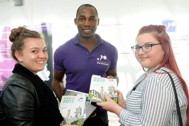 Megan Ritchie, 16, left, and Chelsea-Mae Lucas, 16, with student ambassador Vincent Pericard from the University of PortsmouthPicture: Sarah Standing (161368-7608)
