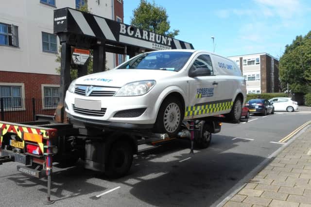 A security guard's car is removed