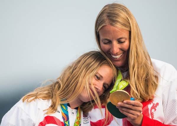 Hannah Mills and Saskia Clark with their gold medals in Rio