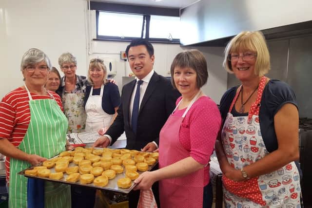 Havant MP Alan Mak with volunteers from the Hayling Island lunch club