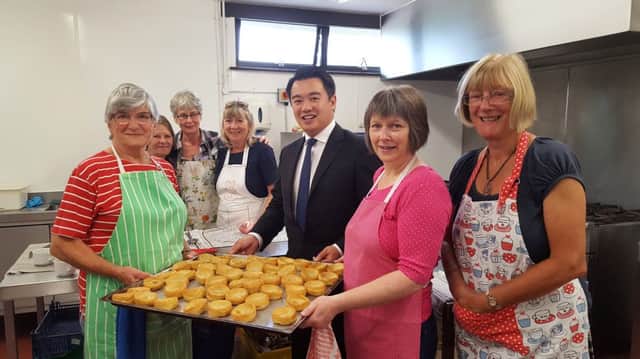 Havant MP Alan Mak with volunteers from the Hayling Island lunch club