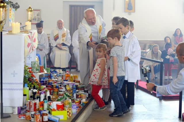 Children at St George's Church, Waterlooville, during the harvest festival service which was broadcast live around the world.