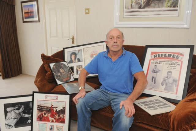 Gary Knight,from Hilsea, unwittingly bought Â£4,300 worth of fake Muhammad Ali, Queen and other memorabilia from Steve Pearson - but is struggling to get his money back Picture: Sarah Standing (161396-3933)