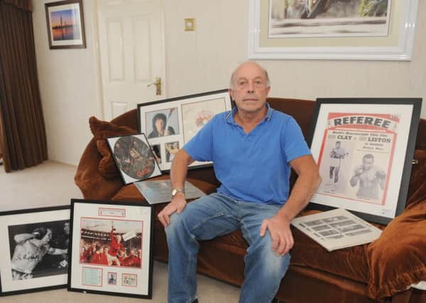 Gary Knight,from Hilsea, unwittingly bought Â£4,300 worth of fake Muhammad Ali, Queen and other memorabilia from Steve Pearson - but is struggling to get his money back Picture: Sarah Standing (161396-3933)