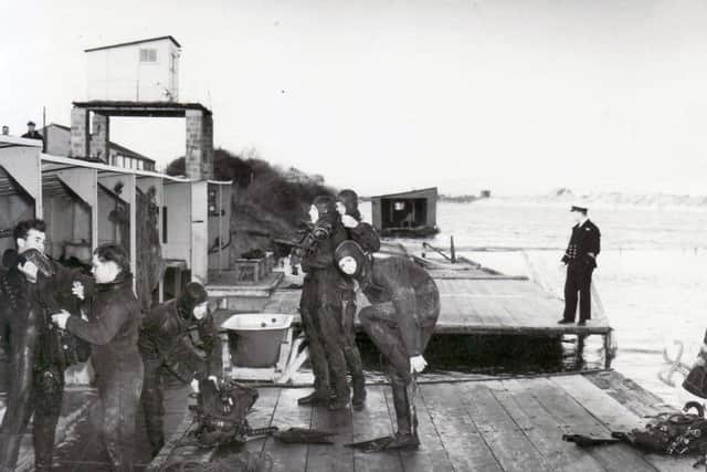 Navy divers, or frogmen as they were known then, on Horsea Island in January 1970