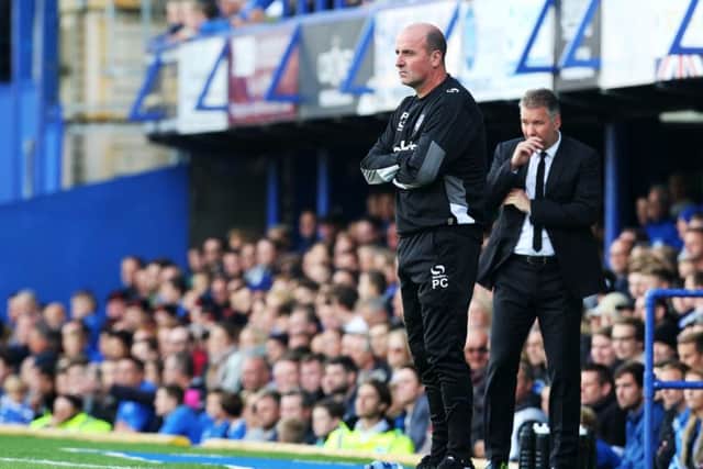 Paul Cook takes his Pompey side to Brisbane Road today Piccture: Joe Pepler