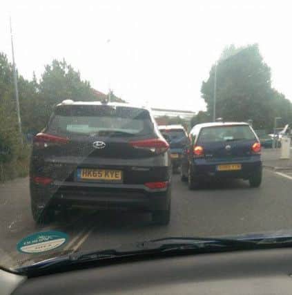 A driver uses the pavement to avoid congestion at a roundabout in Portsmouth. Picture: Tamzin Cormican