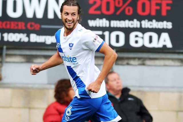 Christian Burgess celebrates his winning goal Picture: Joe Pepler