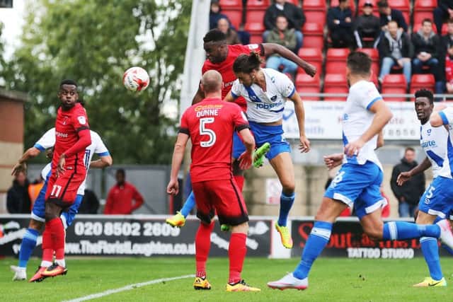 Christian Burgess scores the winner for Pompey at Brisbane Road Picture: Joe Pepler