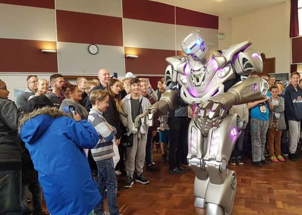 Titan the Robot wows the crowds at the new UTC school in Hilsea Picture: Kimberley Barber