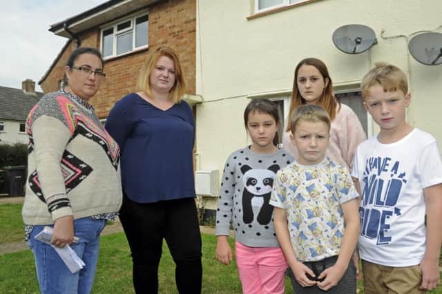 Navy wives, Tracy Stinton (left) and Lucy Stegar and their children (left to right), Rhiannan Stinton (eight), Jasmine Stinton (12), Alfie Stegar (seven), and Harvey Stegar (nine), outside Tracy's MoD house in Gosport which she says is unfit to live in.Picture Ian Hargreaves (161254-2)